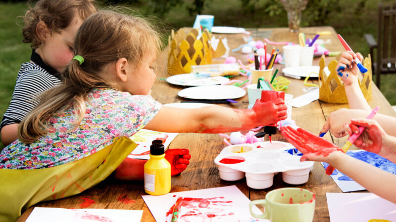 Group of young kids enjoying making artworks