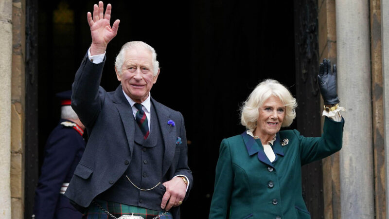 King and Queen Consort waving