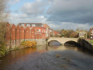 Radcliffe Market hall by the River Irwell
